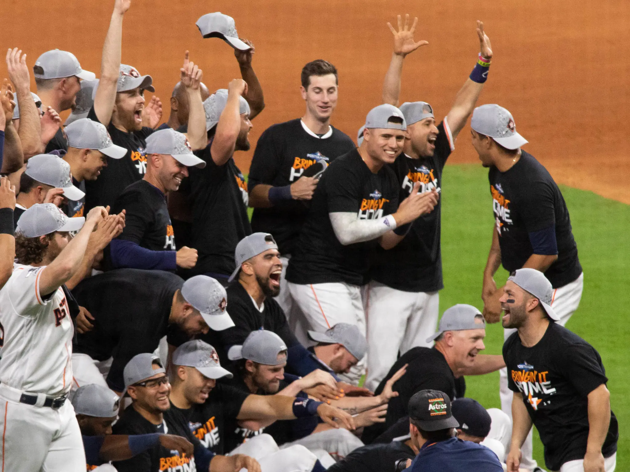 The Astros took a happy team photo after advancing to the American League Championship Series for the third straight year. (Photo by F. Carter Smith)