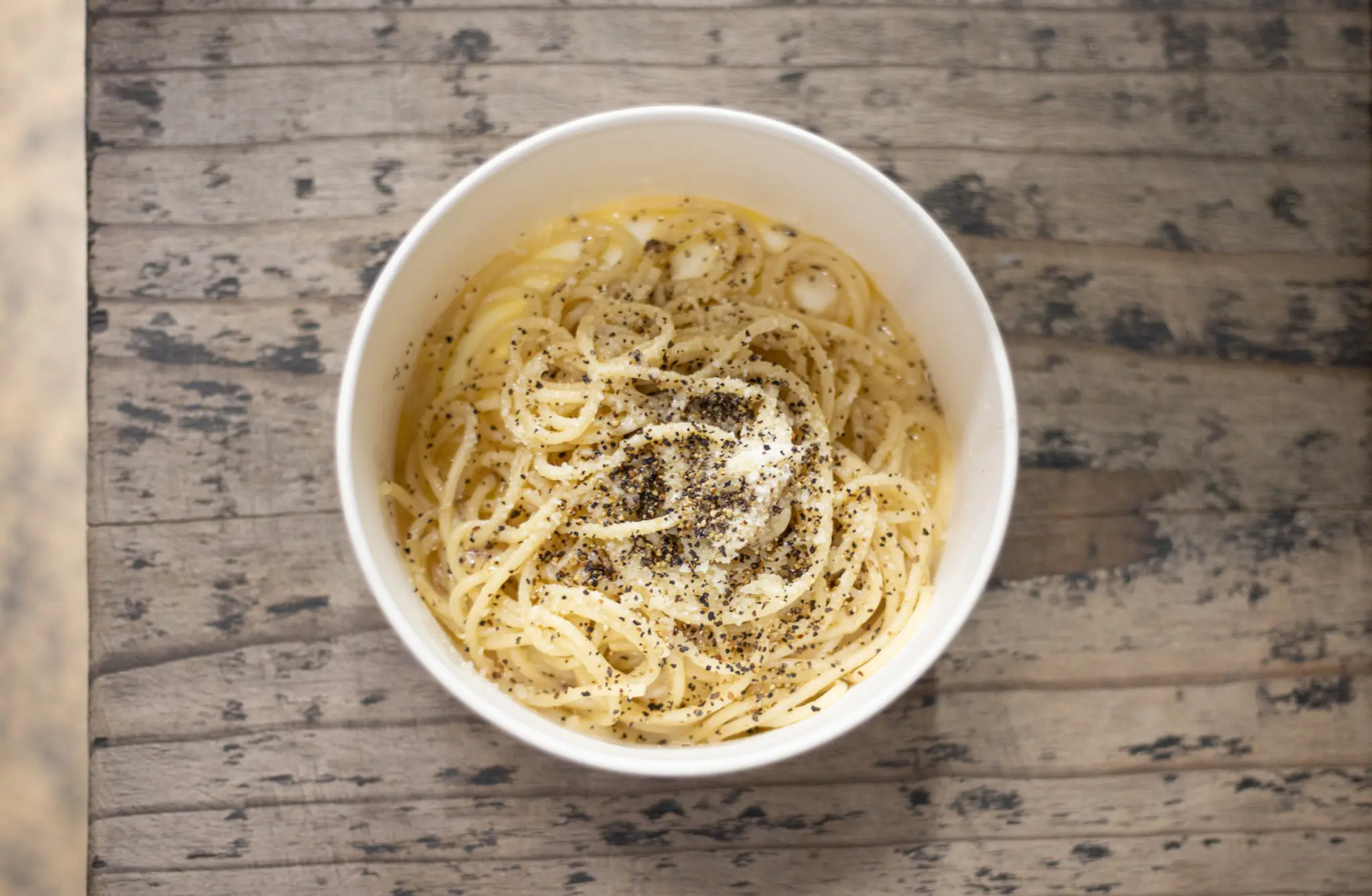 Cacio e Pepe is made with spaghetti, pecorino, parmesan, and black pepper. Courtesy of The Italian Job