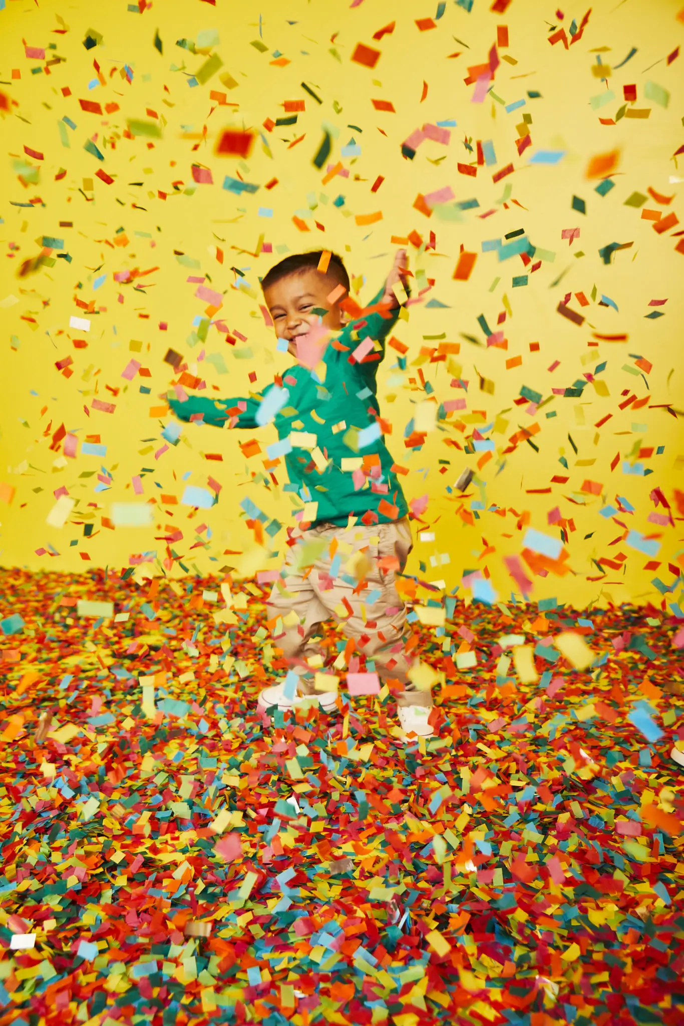 At “Confetti Accumlation,” pounds of colorful confetti fall in slow motion from rotating barrels in the ceiling. (Photo by Cody Bess)