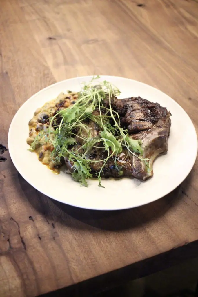 Lockwood Distilling Co.'s new menu will include a pork chop from chef Justin Box. (Photo by Susie Oszustowicz)