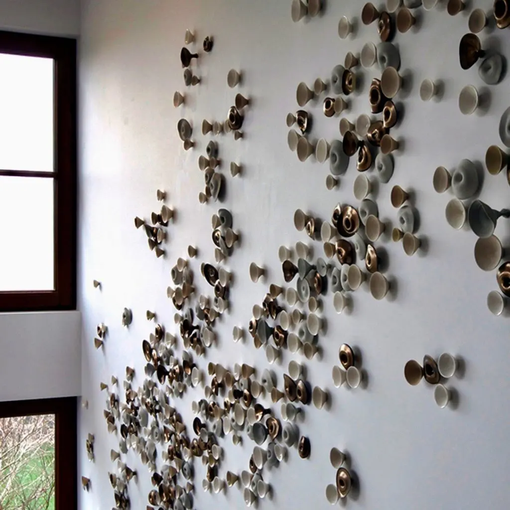 Wall installation by ceramic artist Jennifer Prichard.