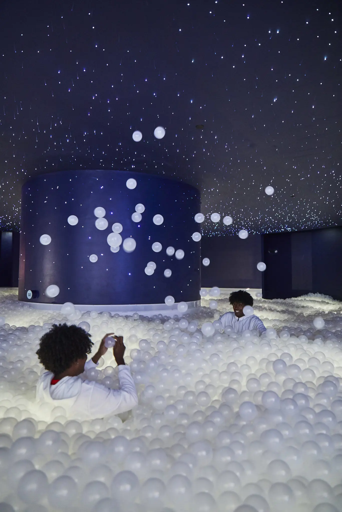 The final room is an homage to NASA, with a large ball pit “inspired by the moon and galaxy that surrounds it.” The pit contains 40,000 plastic balls with 50,000 fiber optic lights to create a moon-like atmosphere. (Photo by Cody Bess)