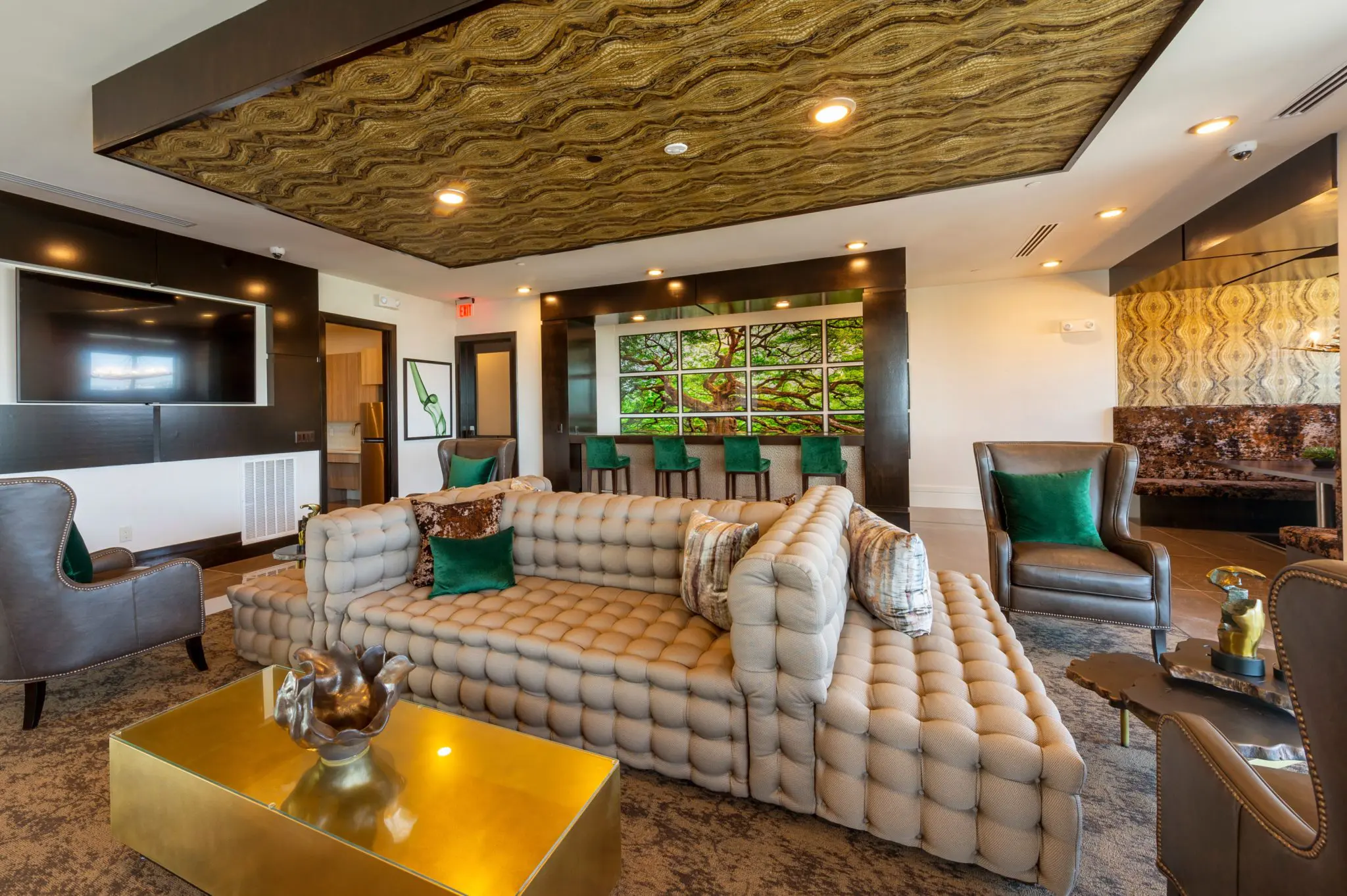 Comfy couches, lush green hues and rich accents add to up to lots of luxury at The Pearl.