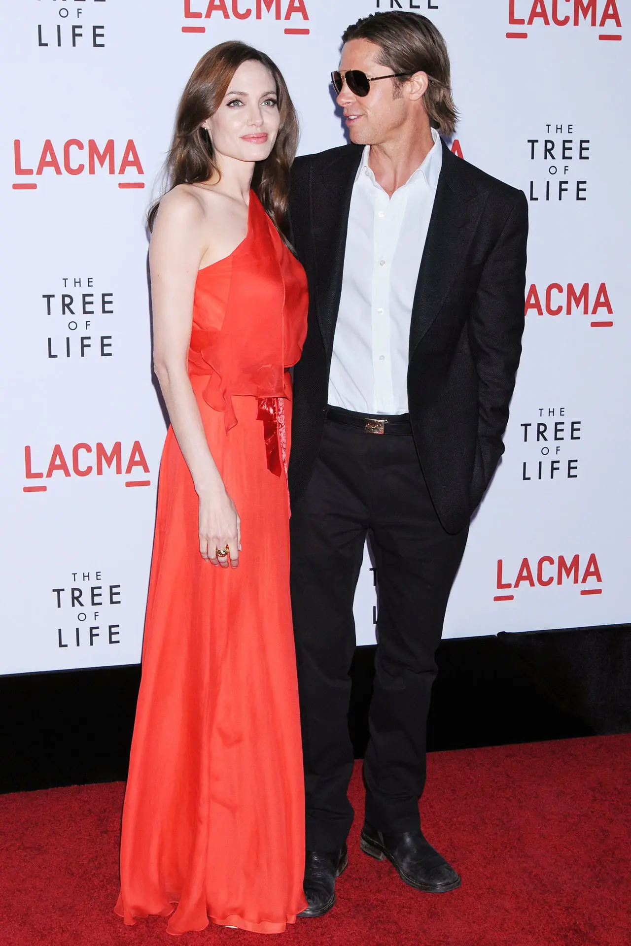 Angelina Jolie wore a Jenny Packham one-shoulder red gown to the 2011 premiere of "Tree of Life" with then-husband Brad Pitt. 