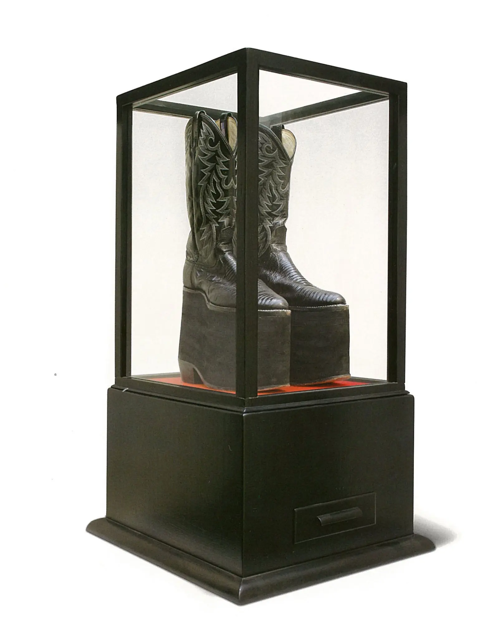 “Height Like Mike: The Boots,” 2004-2005, sponsored by Lester Marks and now in the Marks Collection, features the boots worn in a year-long Art Guys performance in which Jack Massing donned platformed cowboy boots to equal the height of collaborator Michael Galbreth. (Courtesy the Marks Collection)
