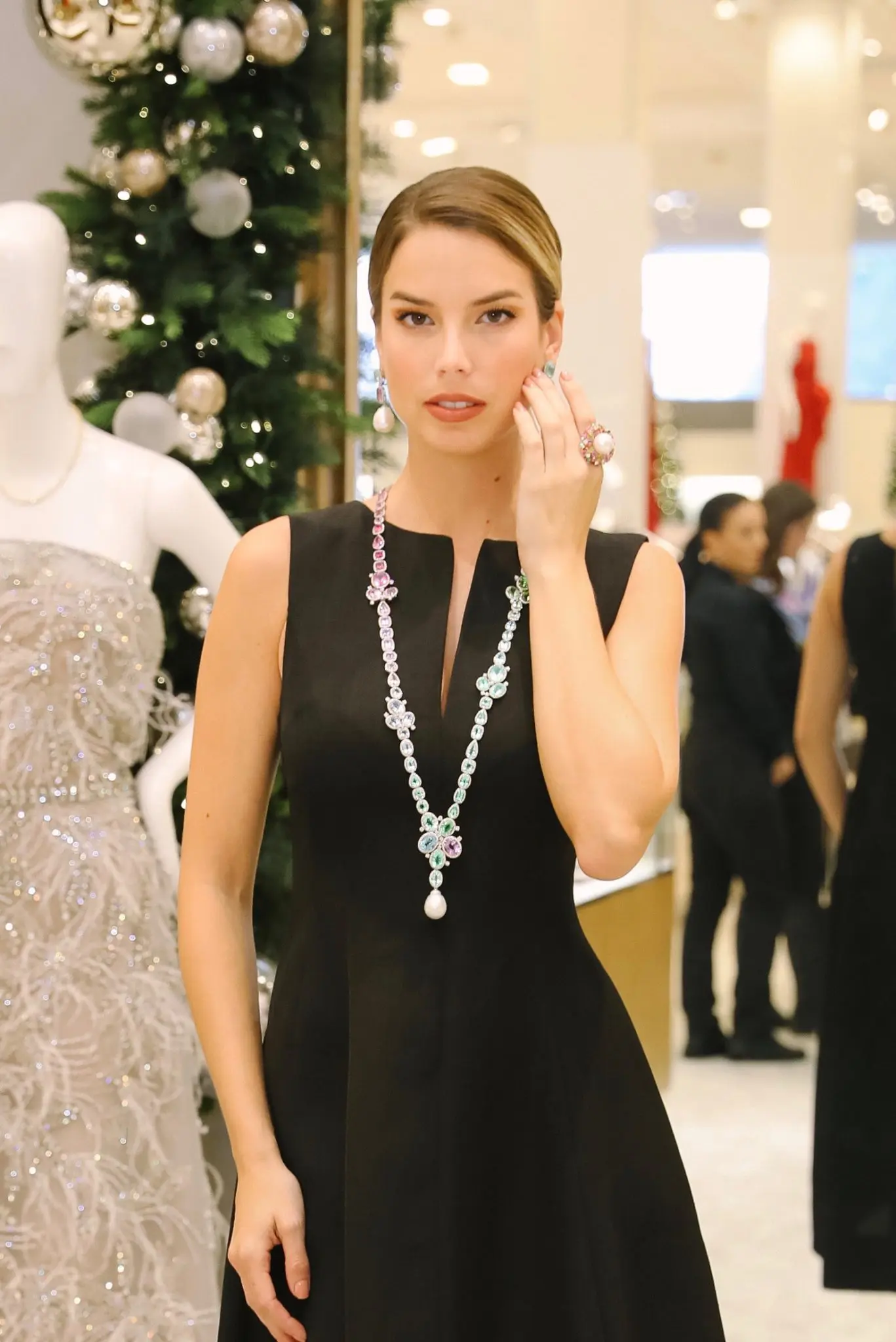 The model wears Margot McKinney's Arcoiris necklace, a $2.3 million piece made from the rarest of Paraiba tourmalines. (Photo by Johnny Than)