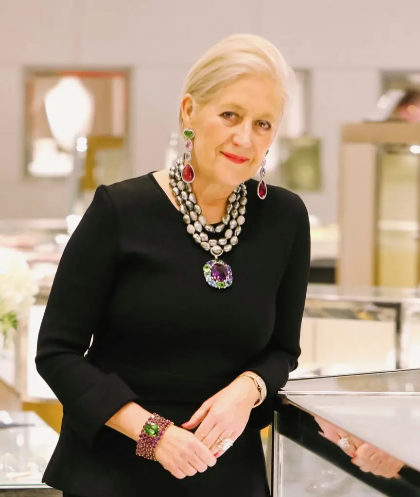 Jewelry designer Margot McKinney models her smashing creations: three separate strands of rare Tahitian Keshi pearls embellished with an amethyst pendant wrapped in wreaths of tanzanite, peridot and tourmaline stones. (Photo by Johnny Than)
