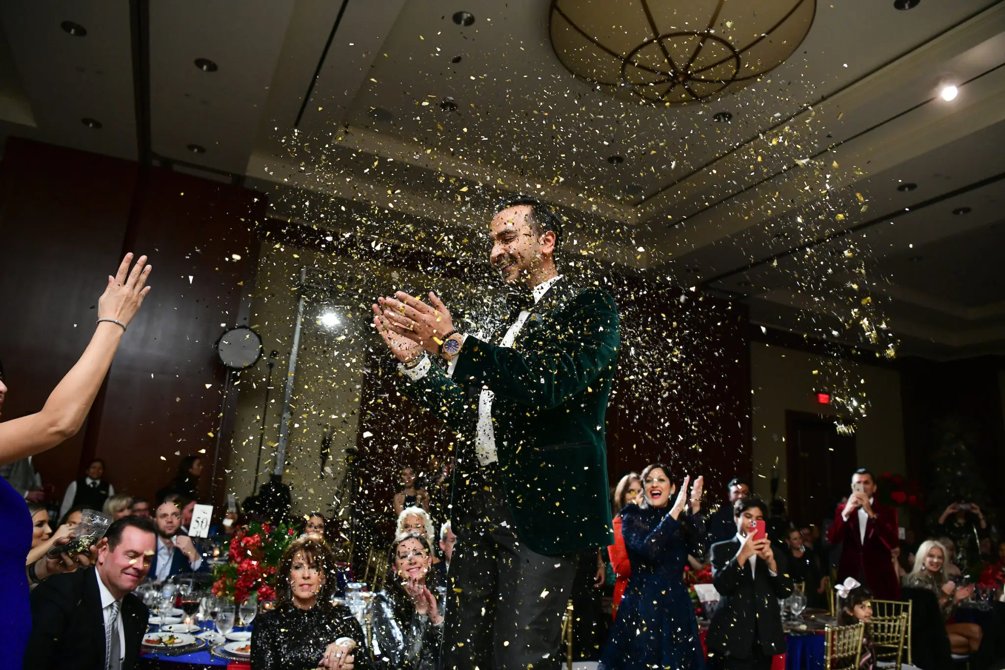 A confetti shower drenches Nick Merchant at Una Notte in Italia. (Photo by Daniel Ortiz)