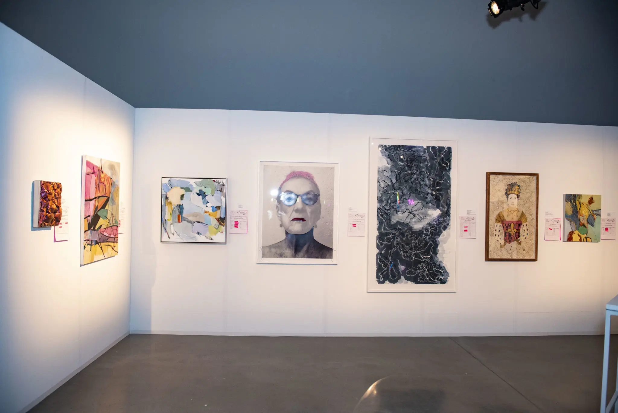 A bright lineup of art donated for the silent auction (Photo by Tamytha Cameron)
