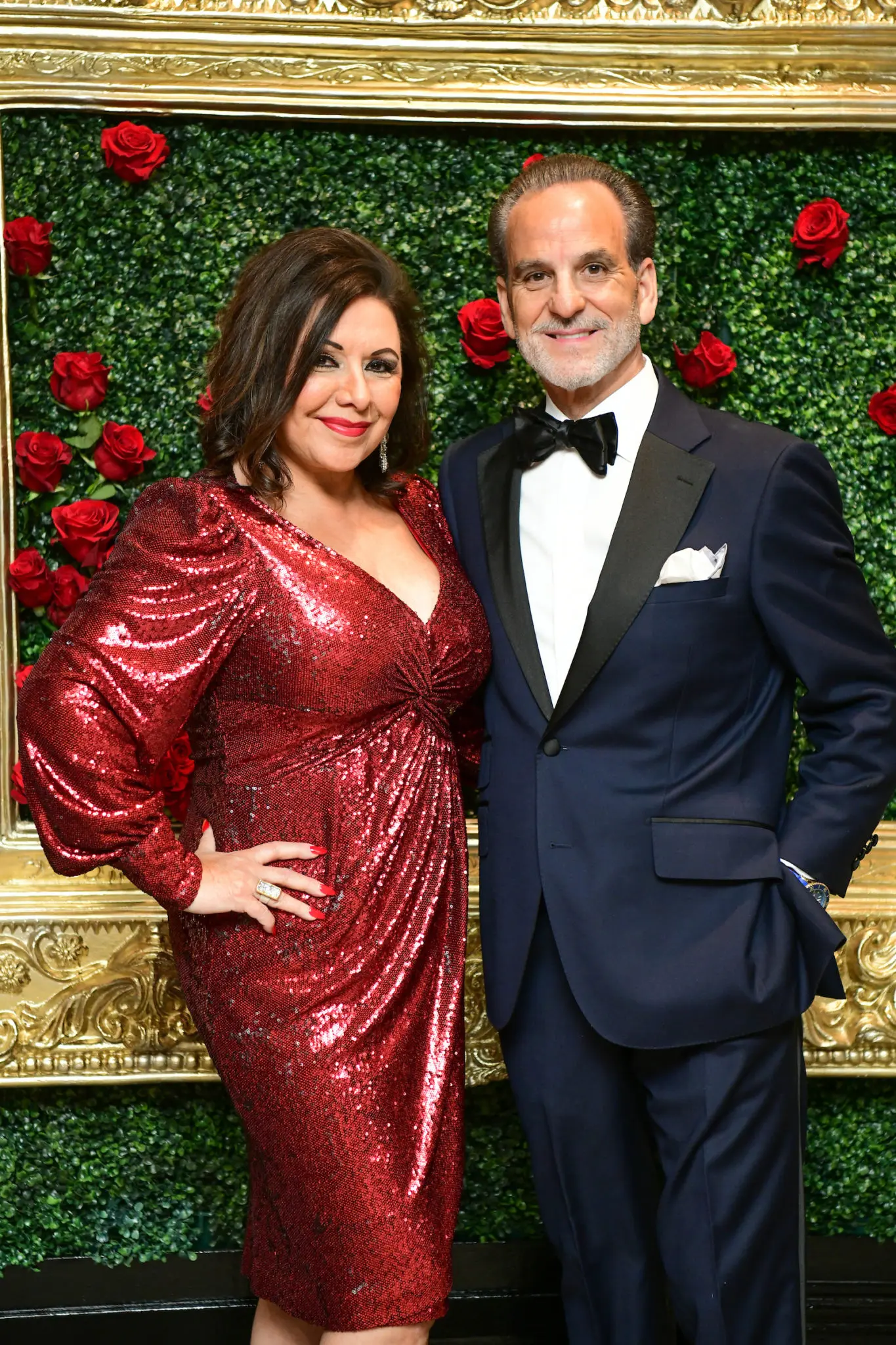 Honorary chair Debbie Festari in sequins & Rudy Festari, maestro of the men's fashion presentation. (Photo by Daniel Ortiz)