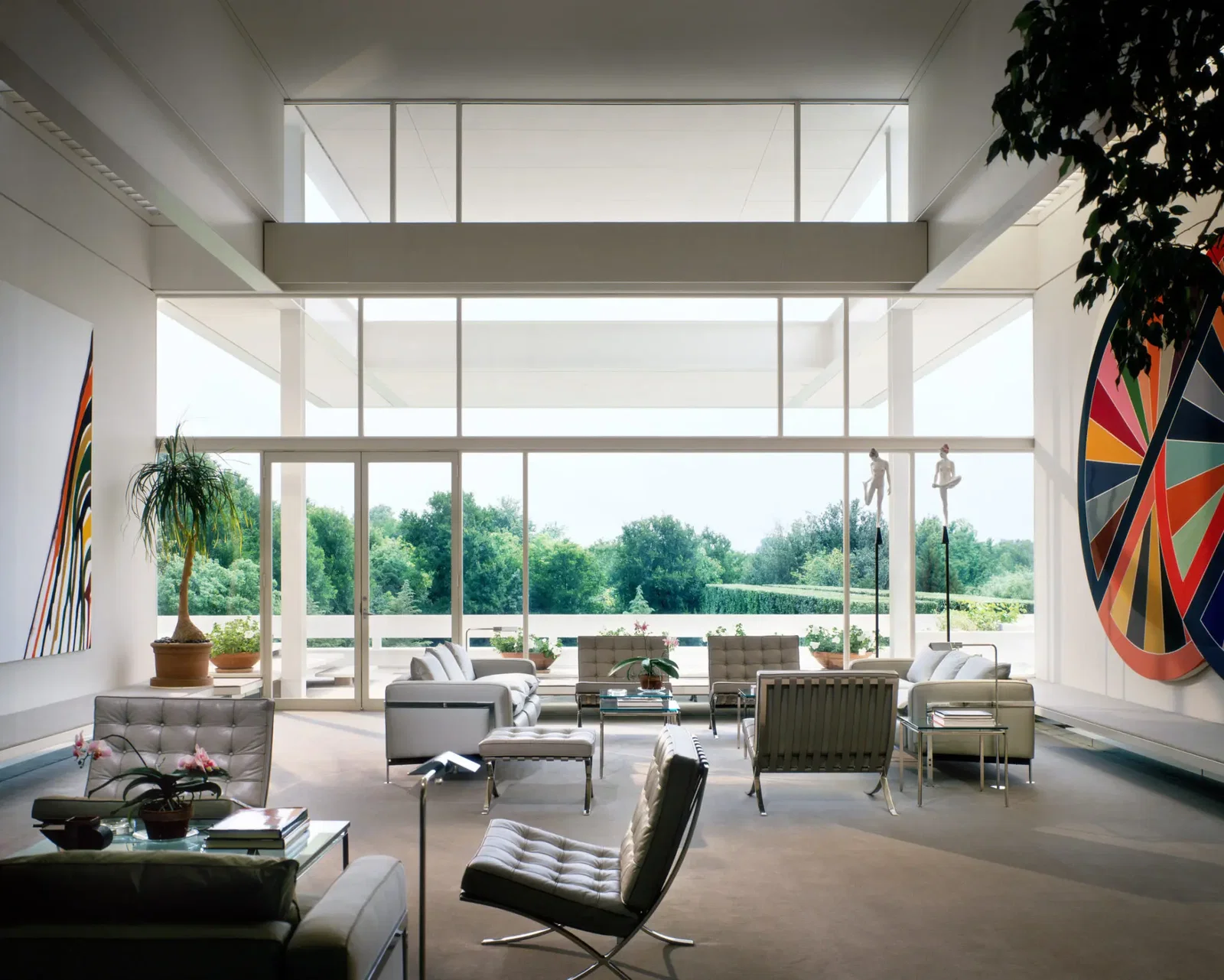 A double-height room in the Bass house, with Morris Louis and Frank Stella artworks and Mies van der Rohe furniture, 1970. (Photo by Scott Frances/Otto)