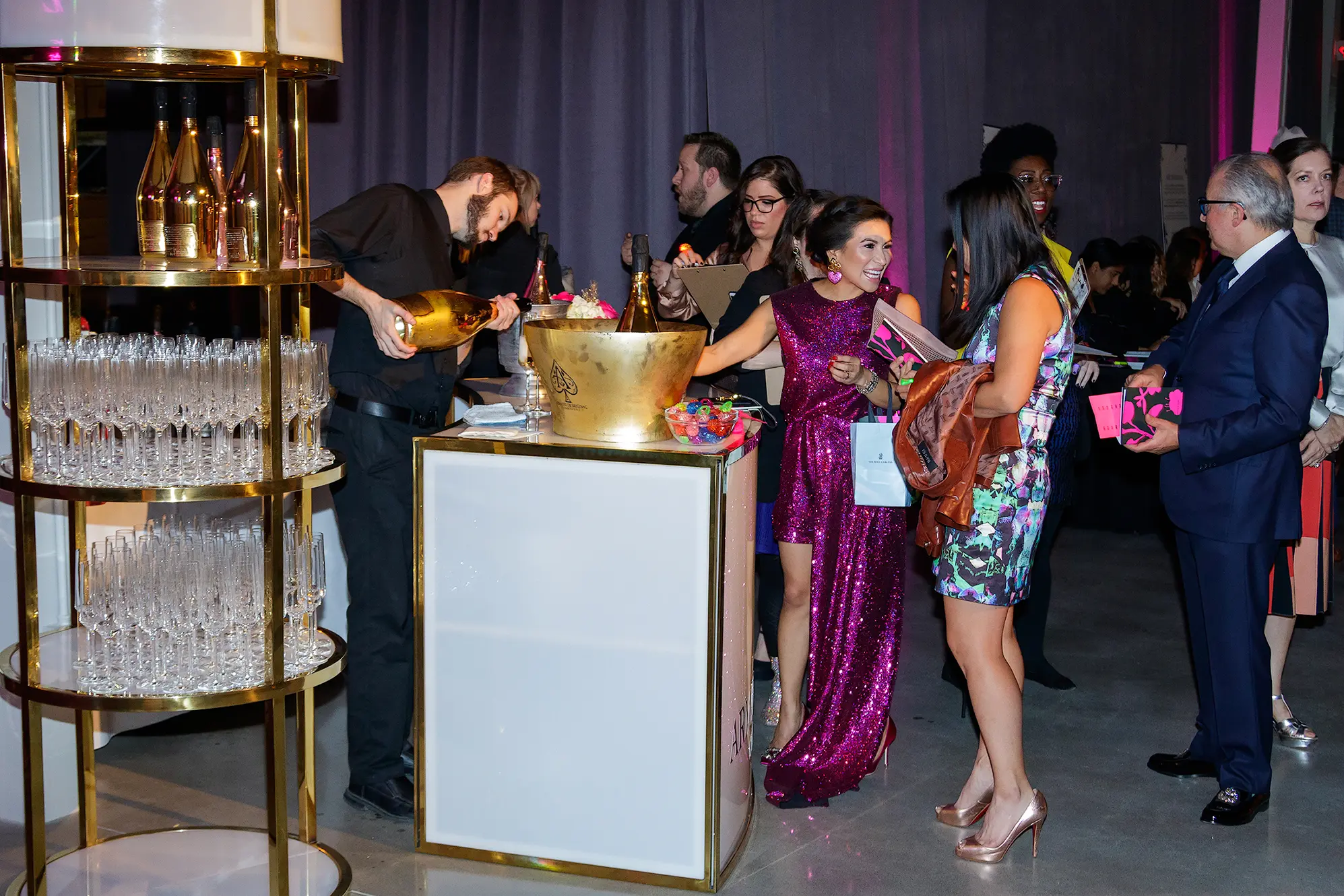 Art For Advocacy supporters enjoy champagne before bidding on the 84 art pieces donated to the auction (Photo by WJNPHOTO)