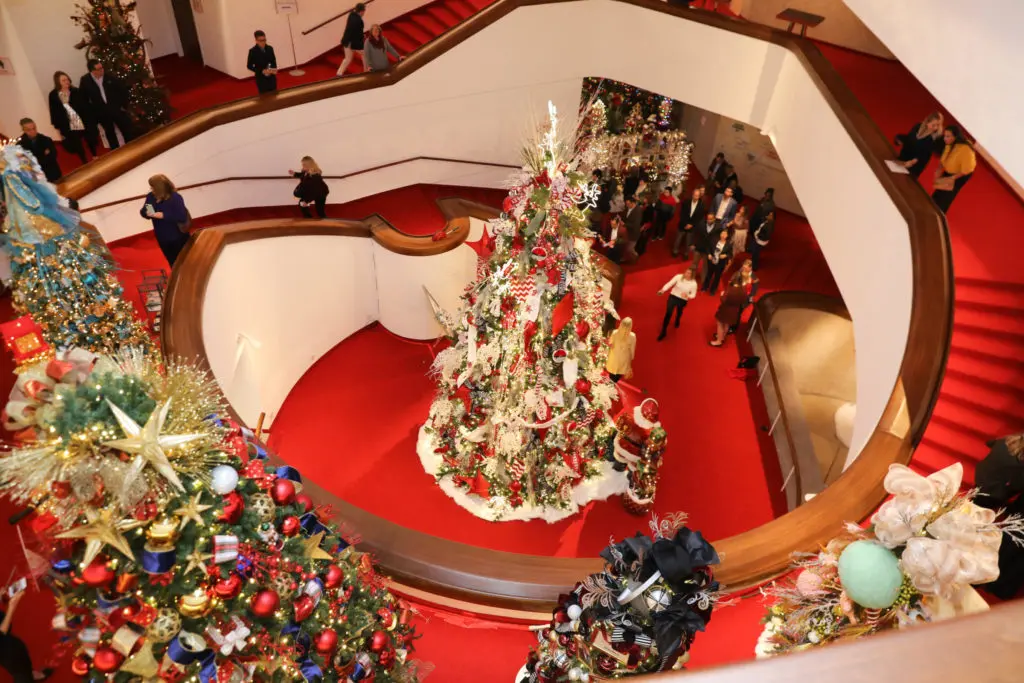 The Alley Theatre lobby glows with the lights from 22 holiday trees. (Photo by Priscilla Dickson)