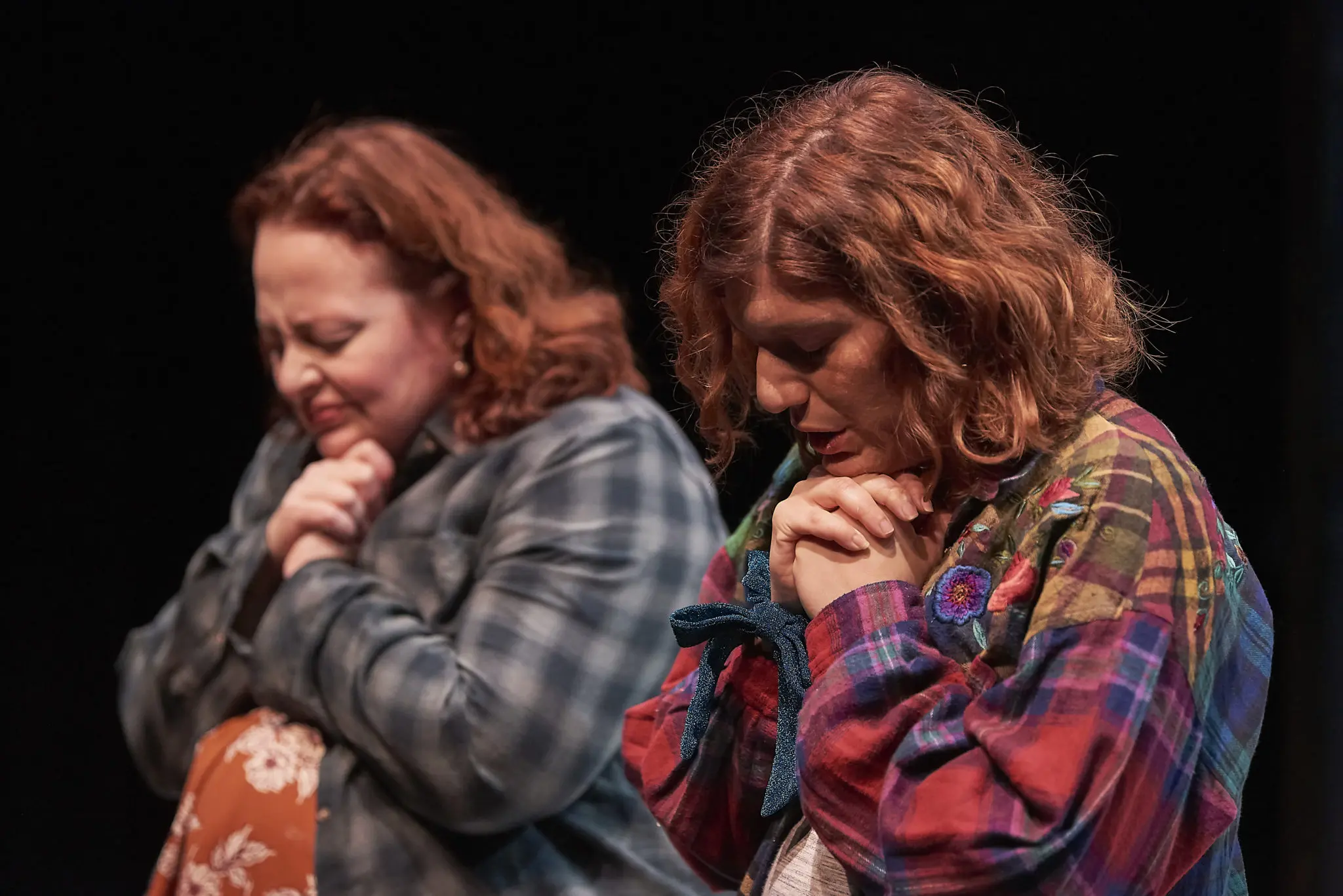Tamarie Cooper and Tasha Gorel play family members who pray together to weather storms. )(Photo by Anthony Rathbun)