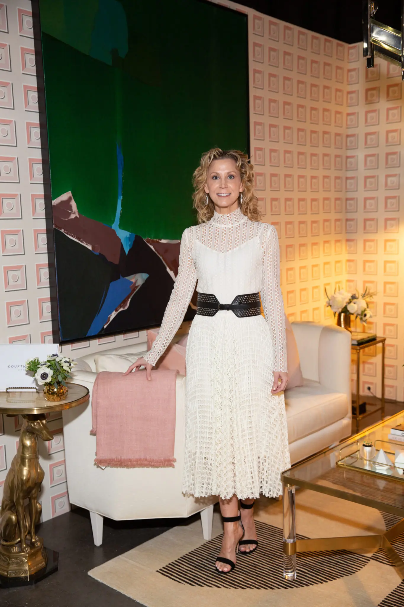 Interior designer Courtney Hill Fertitta, standing in the vignette designed by here namesake Courtney Hill Interiors. (Photo by Jenny Antill Clifton)