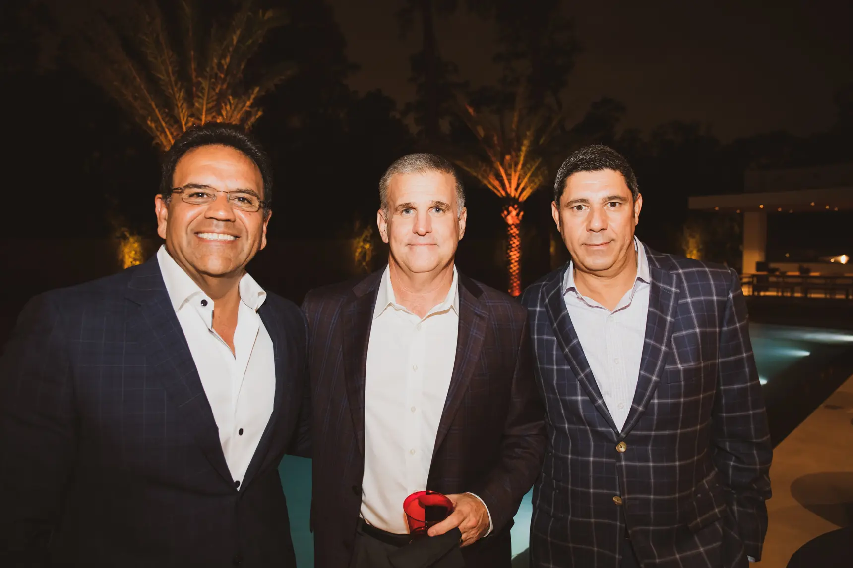 Al Ross, with Ferrari of Houston's Tony Nevotti, Joe Maniaci at a party at 8833 Memorial Drive, which sold in January. (Photo Courtesy of Brightcatch Media) 