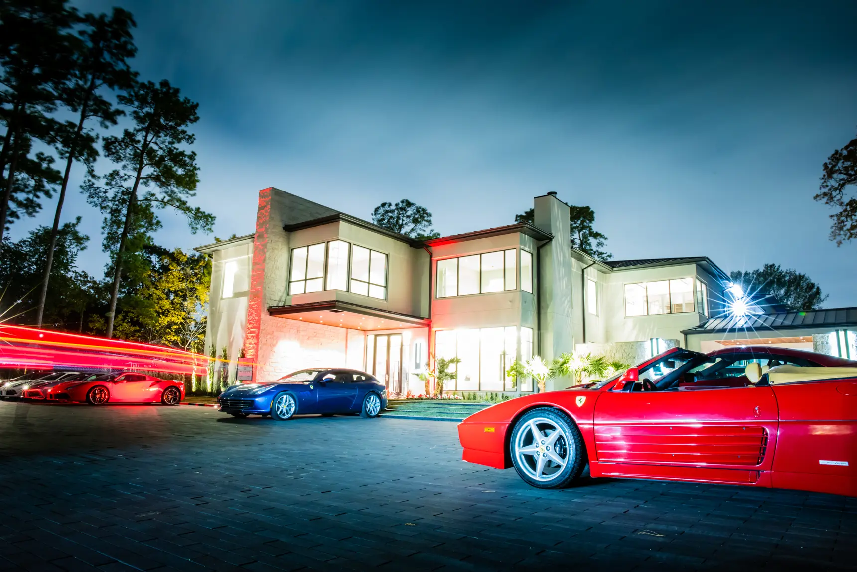 The parking courtyard at the Al Ross home on Memorial Drive filled with Ferraris. (Photo by Brightcatch Media)
