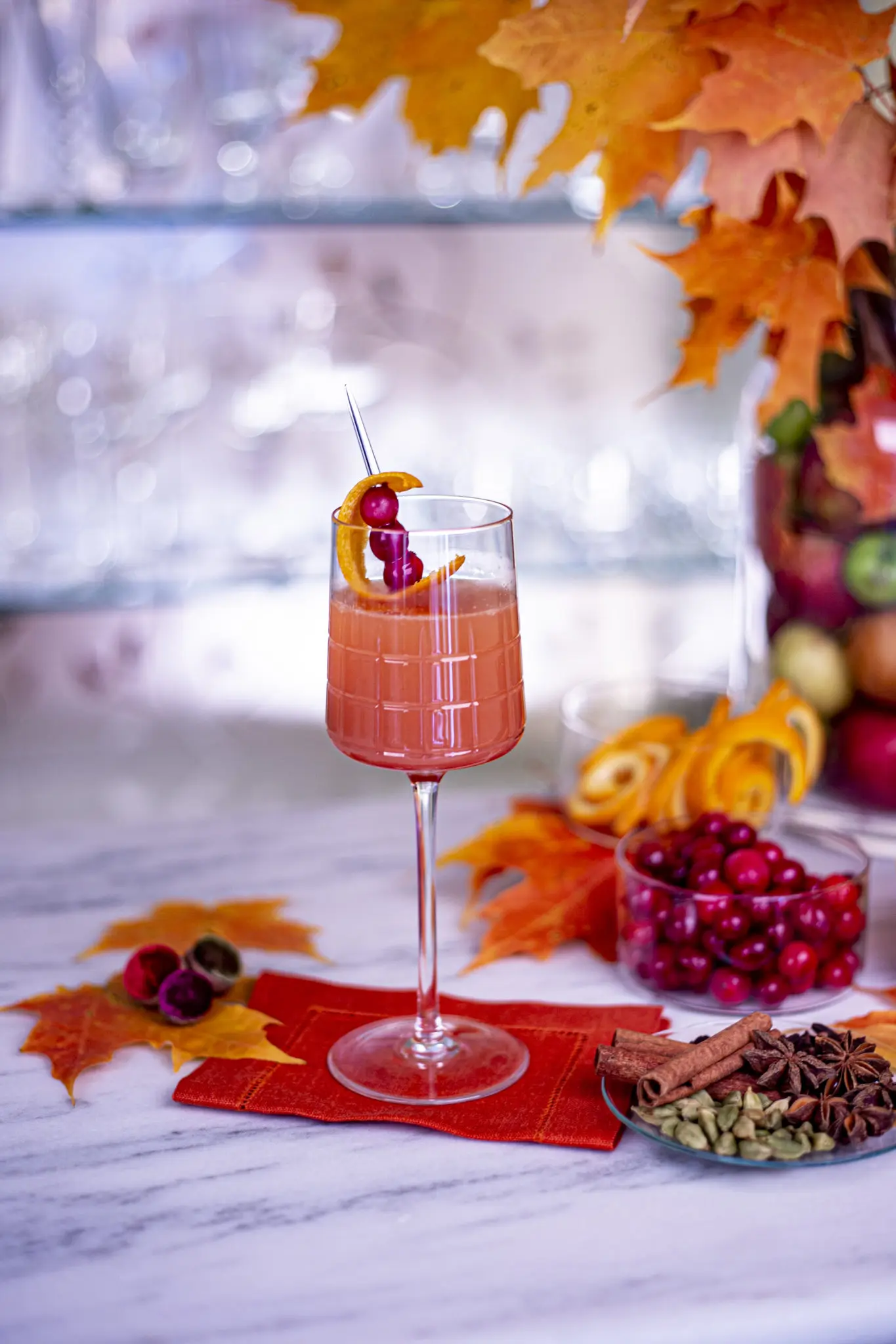 The Cranberry Sauce Punch with fresh cranberry, orange and lime juice, Amarao Montenegro, Brut champagne, and spiked cranberries.
