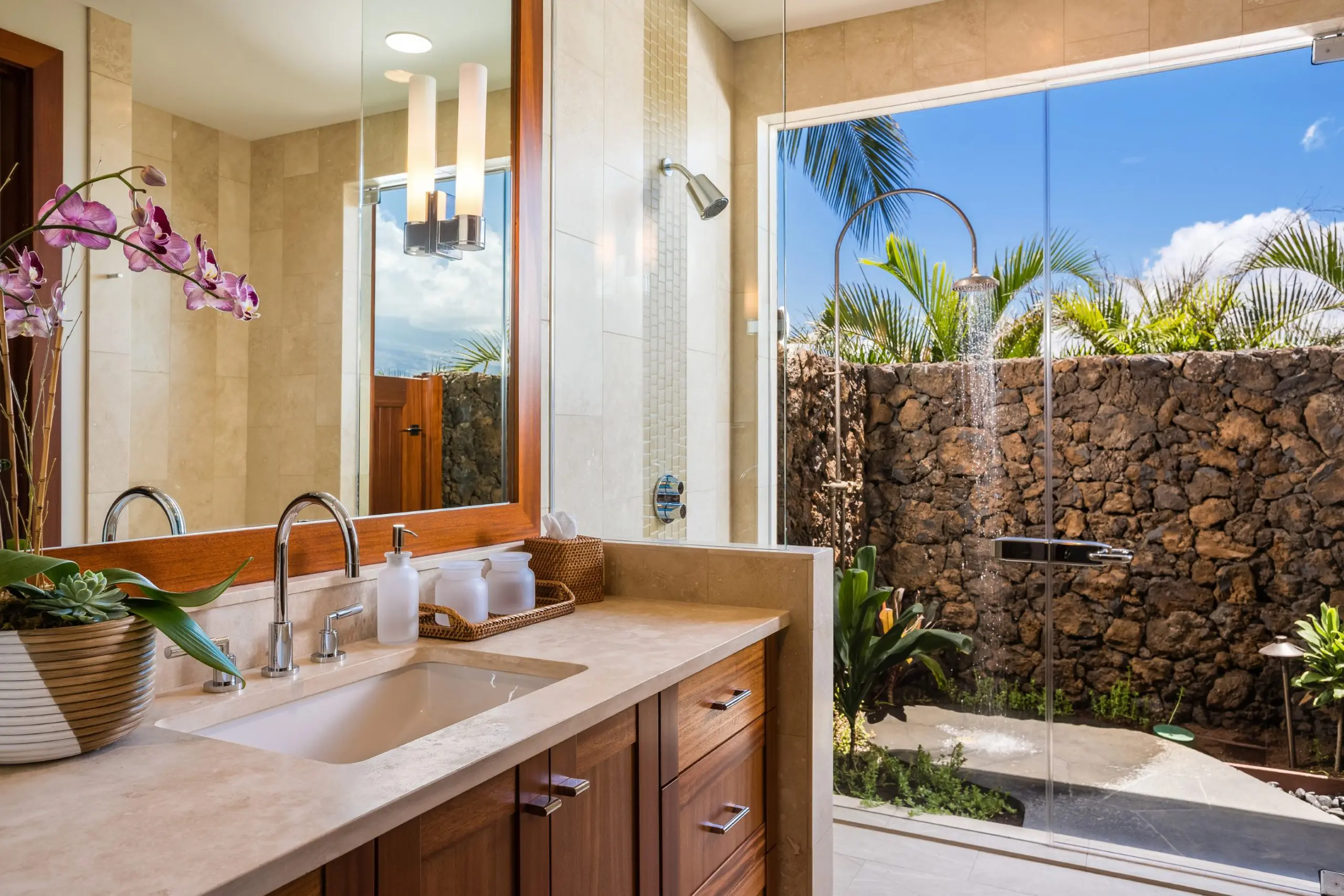 Many of the homes on the market feature authentic outdoor showers perfect for vacation living. (Photo by Hualalai Resort)