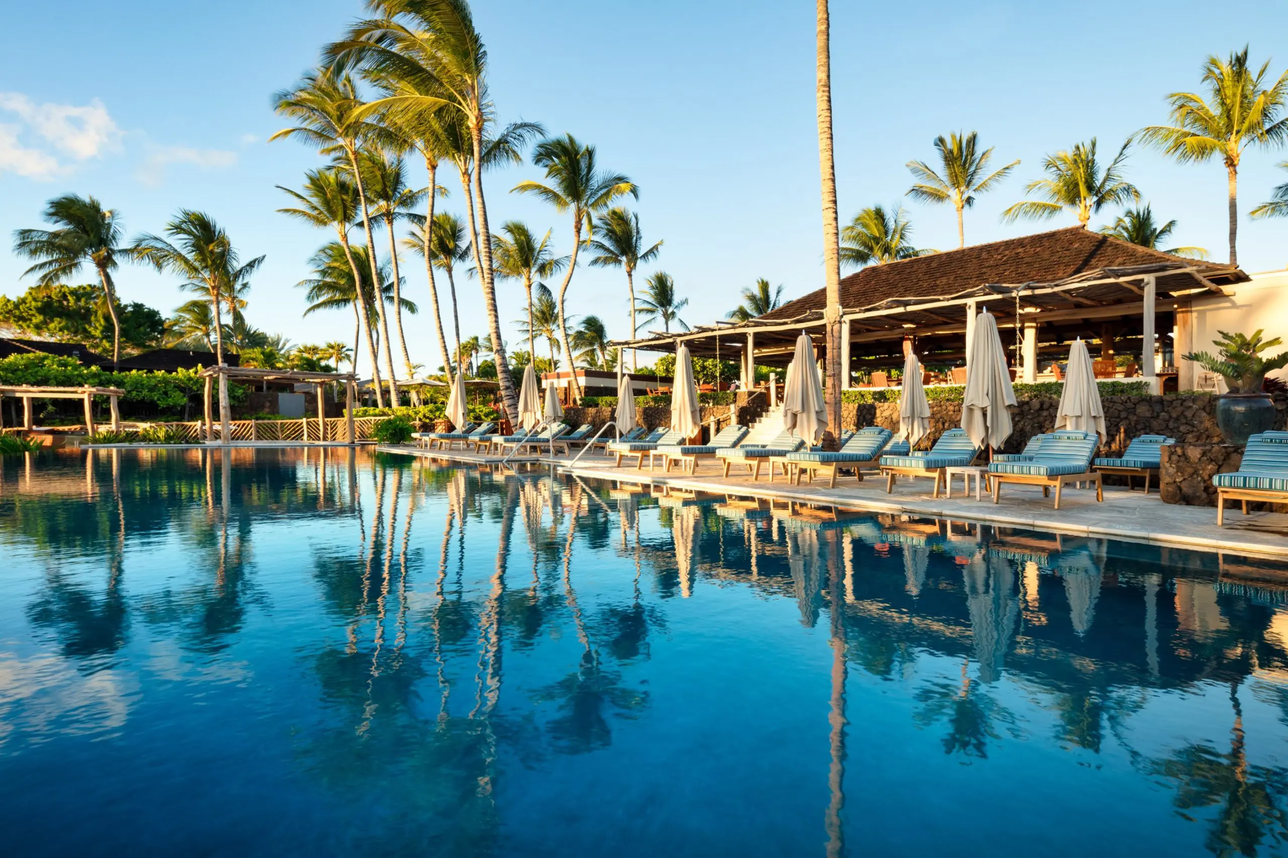 Homeowners at the resort have exclusive access to the beachfront Canoe Club complete with restaurant and refreshing pools. (Photo by Hualalai Resort)