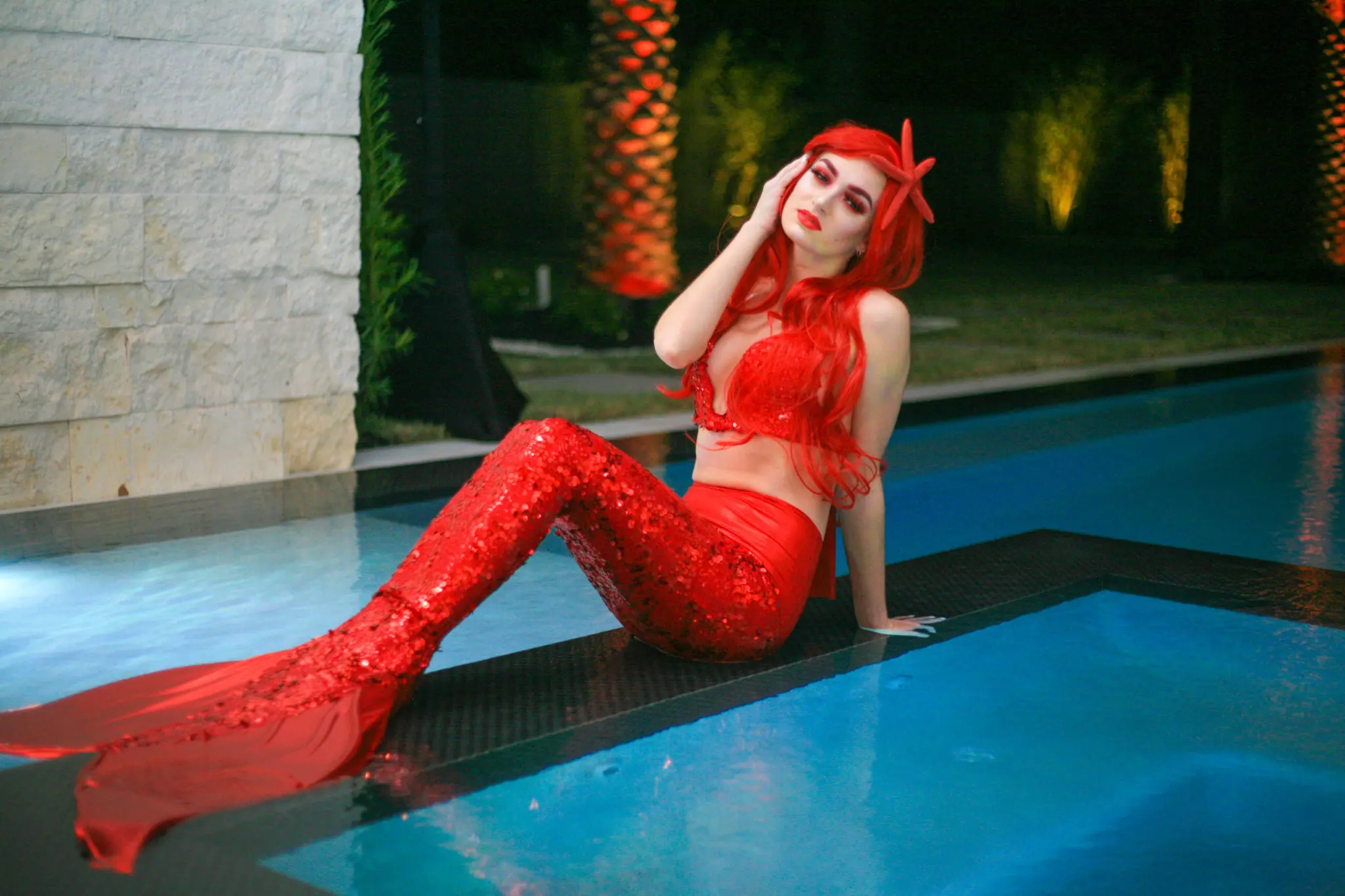 The Al Ross luxury home, setting for the Ferrari Festival kickoff, featured a mermaid in blazing Ferrari red sequins. (Photo courtesy Brightcatch Media) (Photo by Courtesy Brightcatch Media)