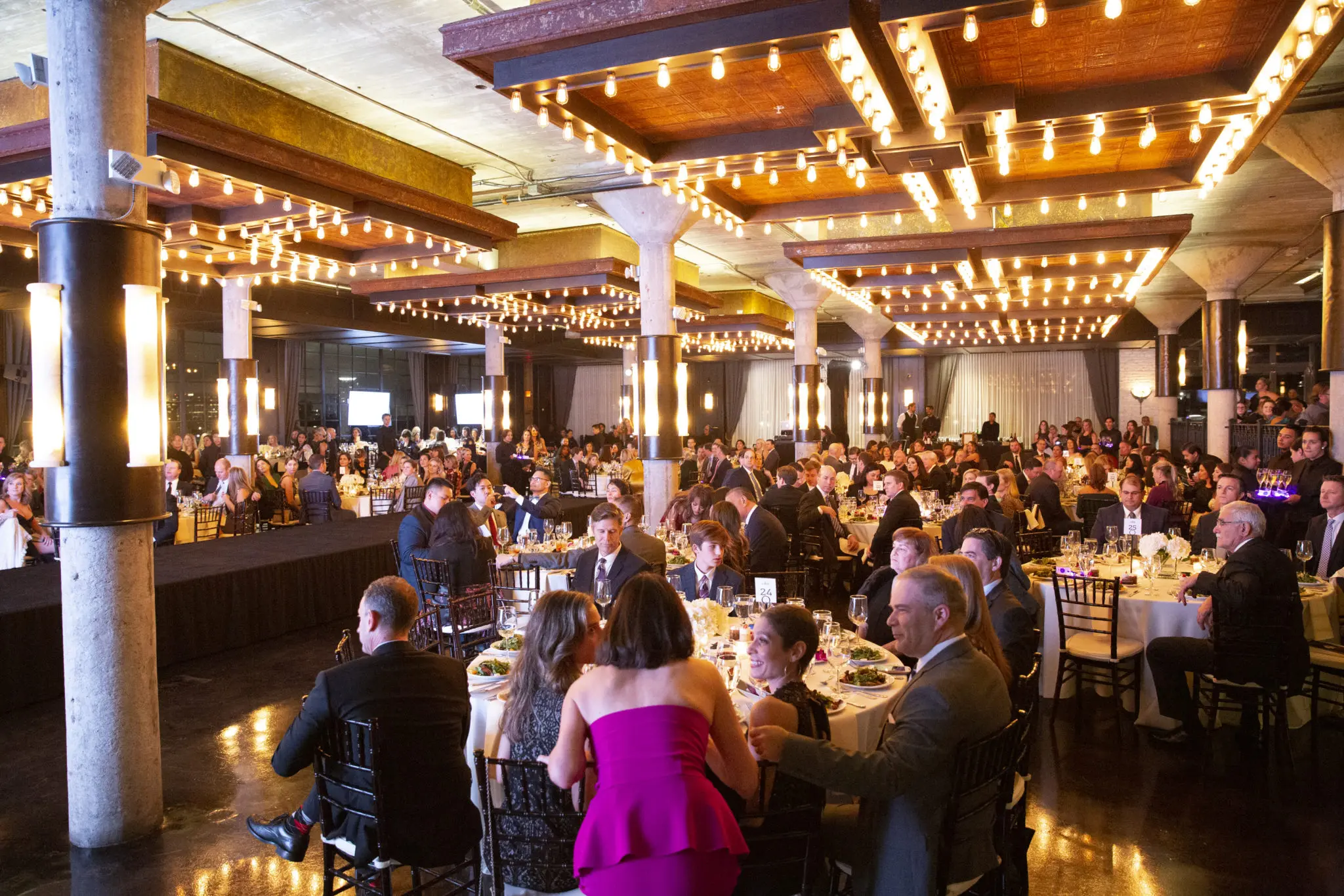 The Astorian ballroom is packed for the benefit evening. (Photo by Jenny Antill Clifton)