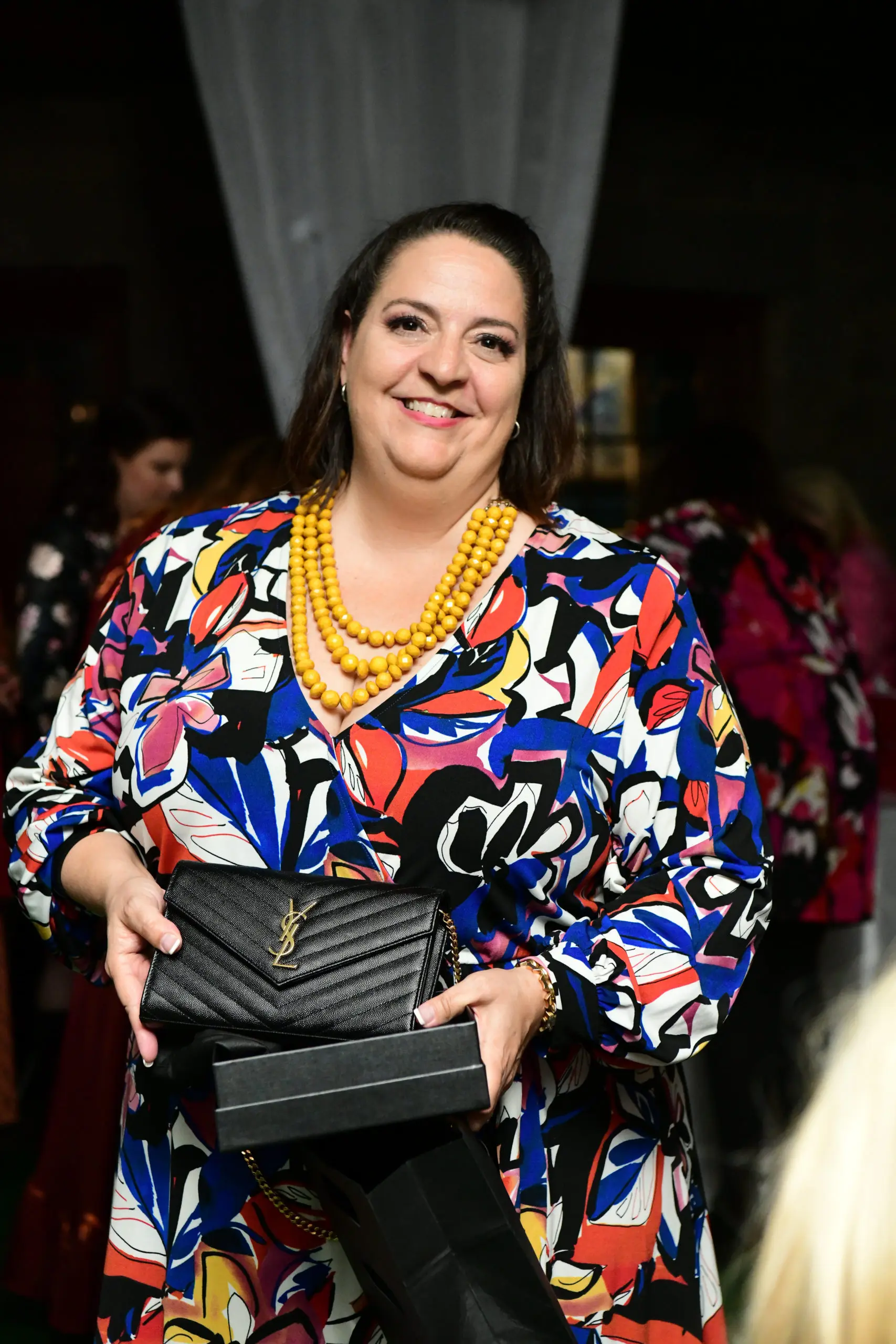Ileana Couret-Endom's raffle ticket led to a new Saint Laurent handbag. (Photo by Daniel Ortiz)
