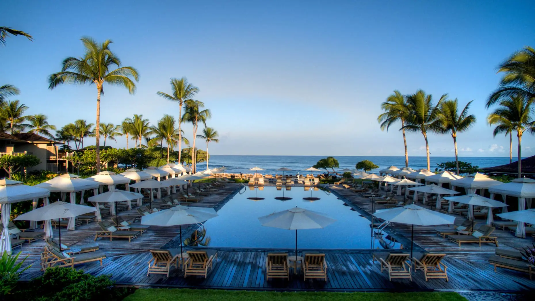 The poolside service at the Four Seasons Haualalai is unparalleled. Expect complimentary frozen popsicles, aloe vera and phone chargers delivered to your lounge chair. (Photo by Hualalai Resort)