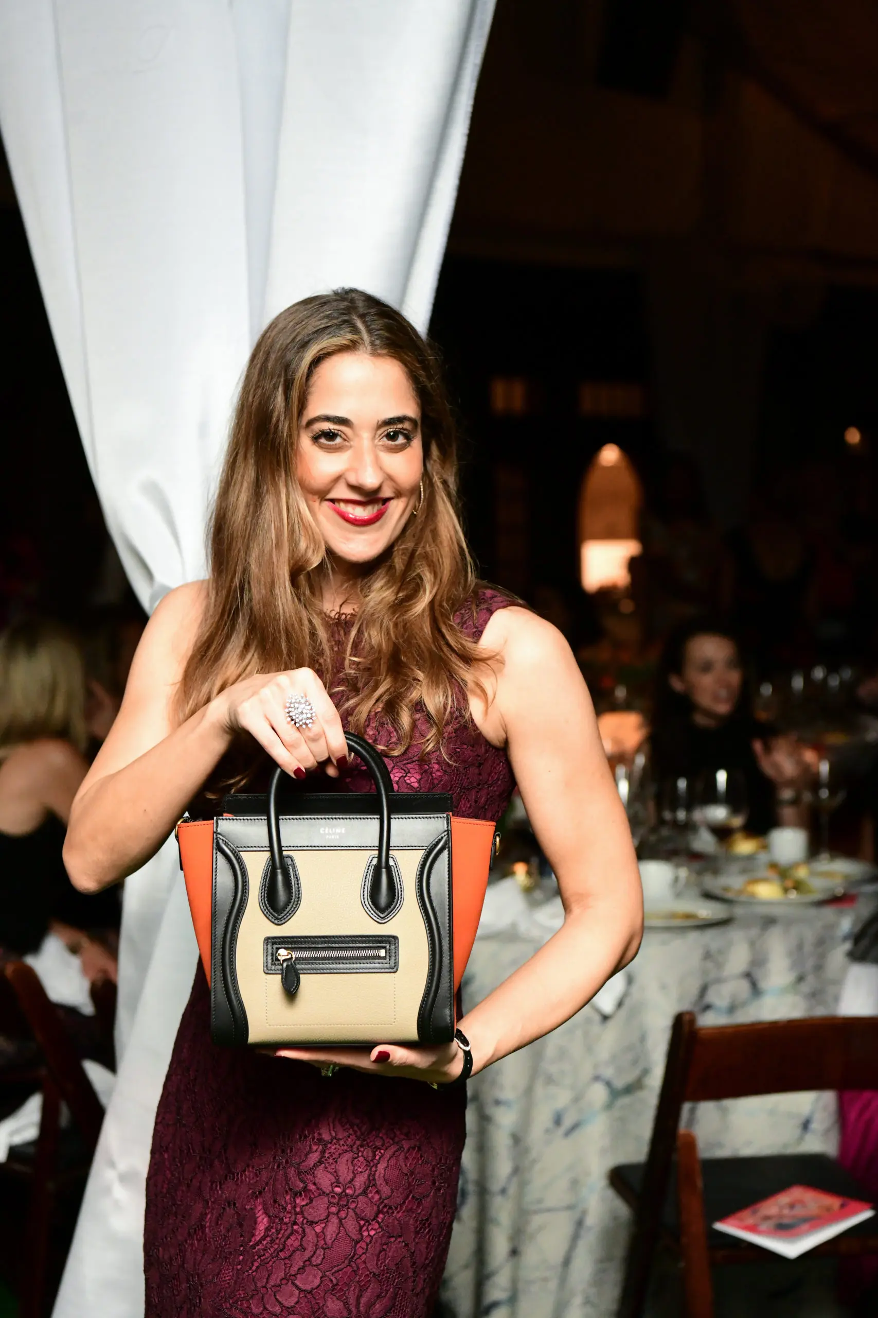 Kristina Somerville sports her raffle loot, a Céline handbag from The Webster. (Photo by Daniel Ortiz)