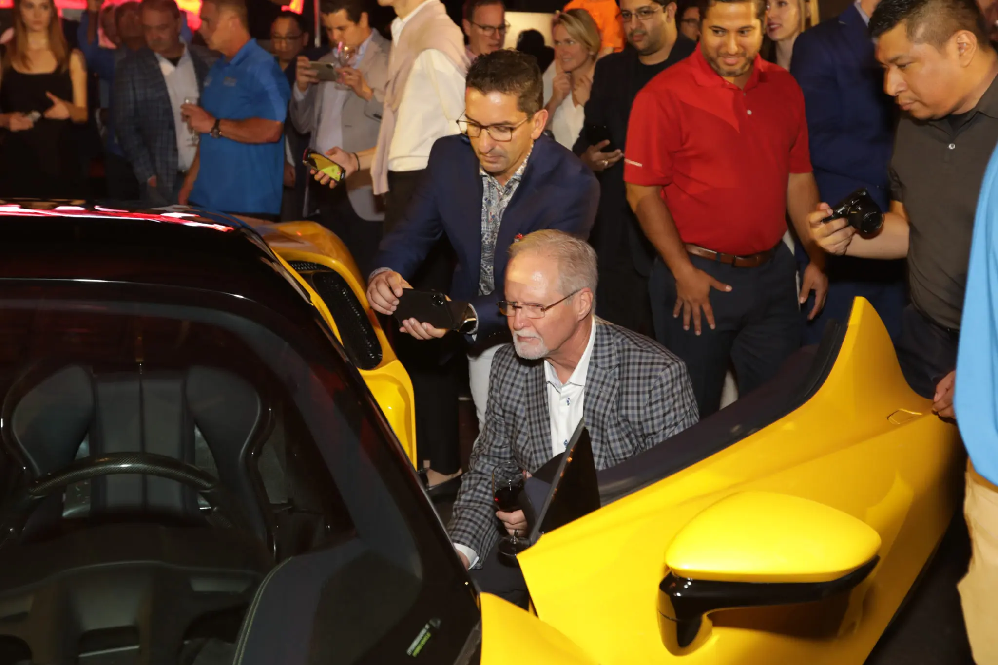 Ferrari fans inspect the new SF90 Stradale.