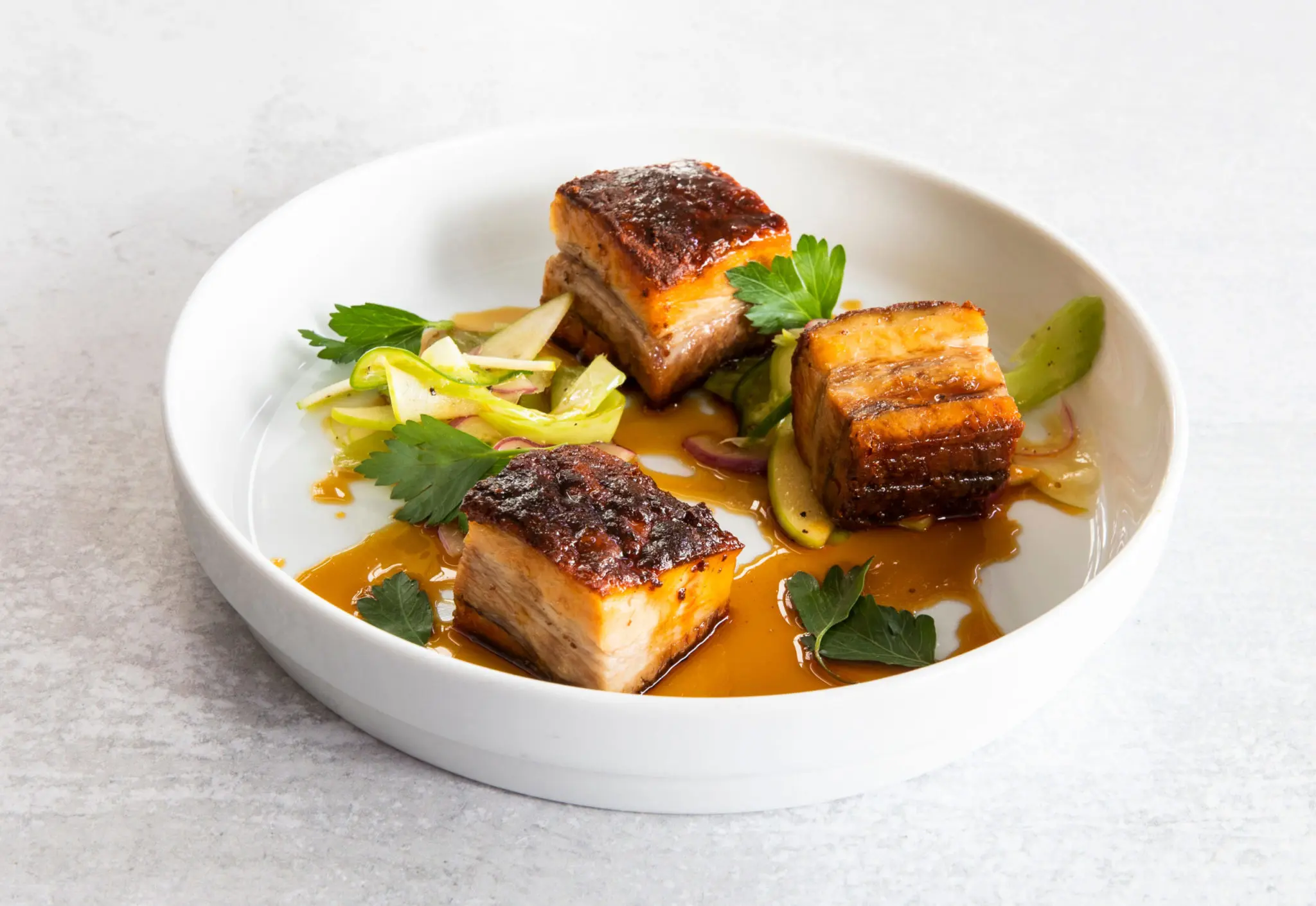 Slow-roasted pork belly with Steen's cane syrup (Photo by Julie Soefer)