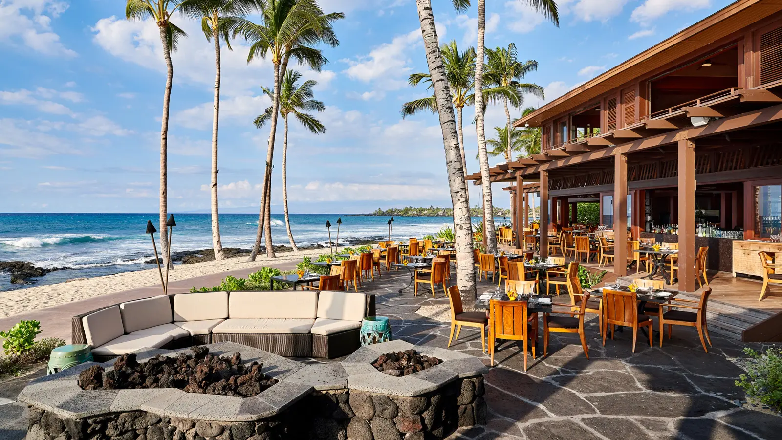 The dining options at the hotel offer oceanside experiences with fresh gourmet fare. (Photo by Hualalai Resort)