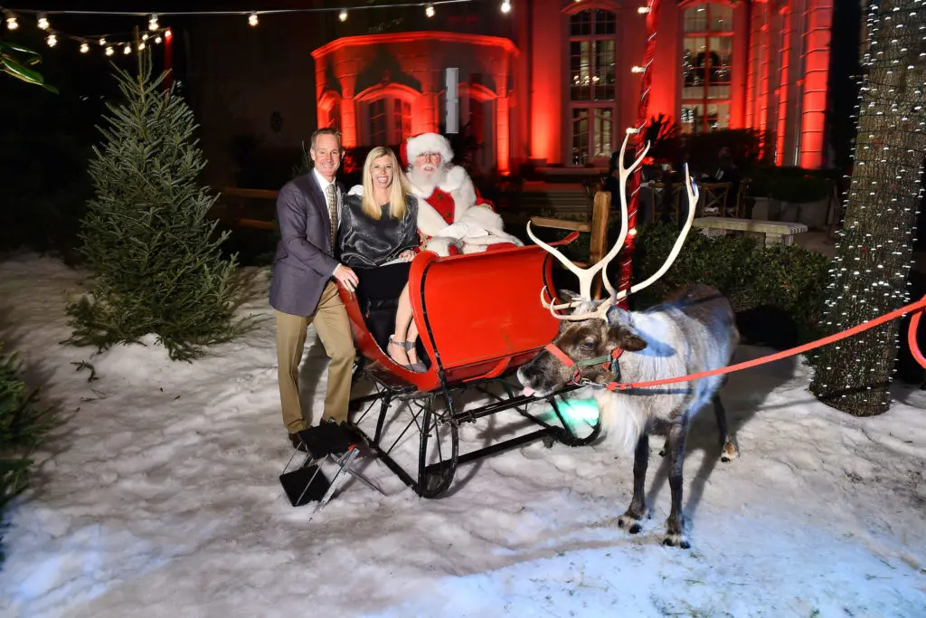  Dan & Jennifer Blum have their photo taken with the Reindeer at the 2019 M.D. Anderson Santa's Elves Party at the  Fertitta family home.  (Photo by Dave Rossman)