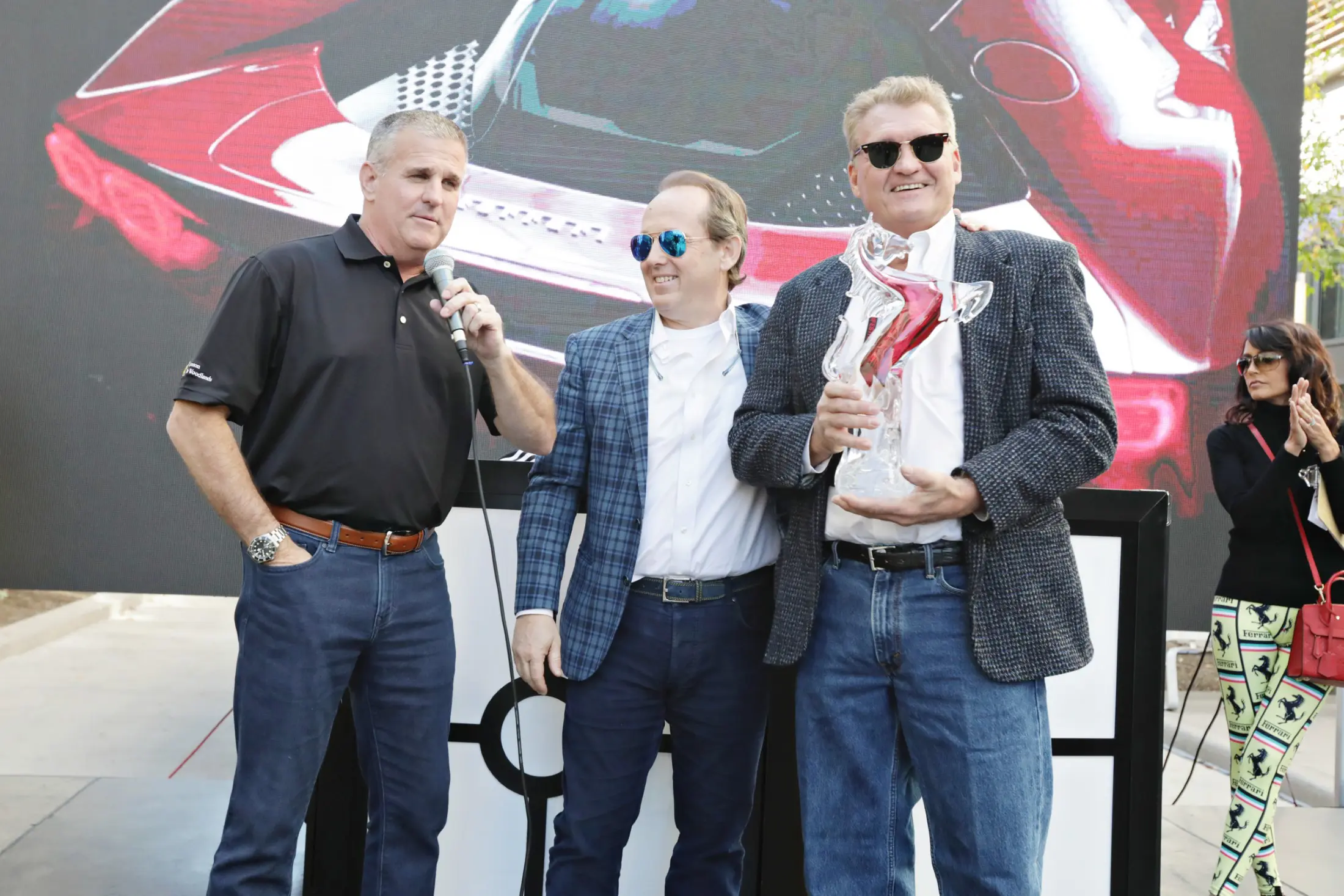 And the winner is Phil Mulacek, right, presented his award by Ferrari of Houston's Tony Nevotti and Ferrari Festival founder Franco Valobra. (Photo by Ulisses G.)