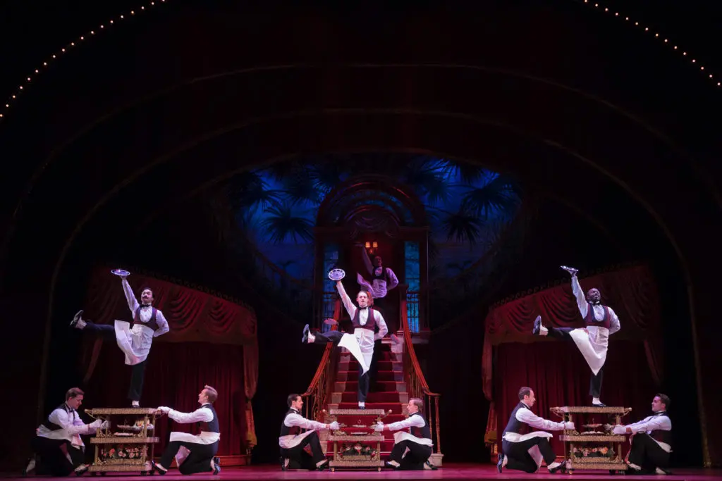 The waiters dance for Dolly. (Photo by Julieta Cervantes)