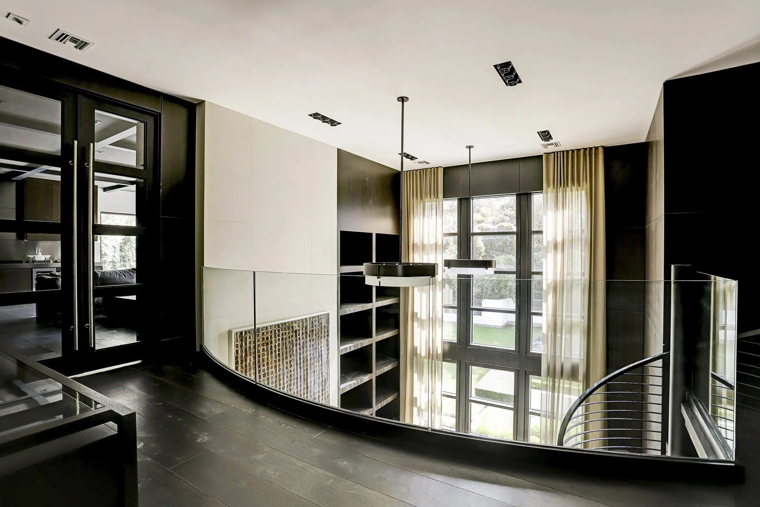 French doors lead to the cigar room from the balcony overlooking the office. (Photo by TK Images)