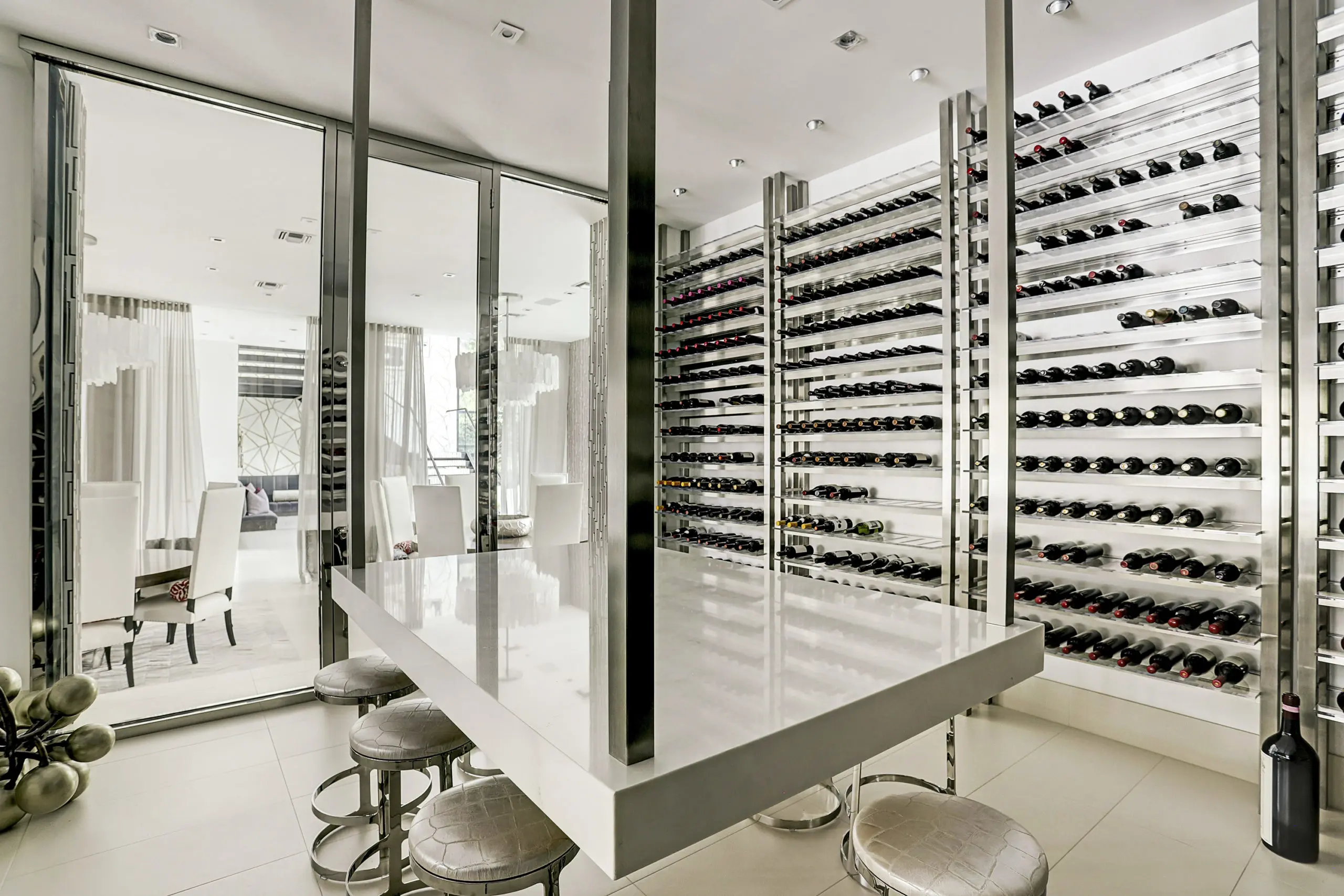 The acrylic-encased wine room offers views to the dining room on one side and the bar on the other (Photo by TK Images)