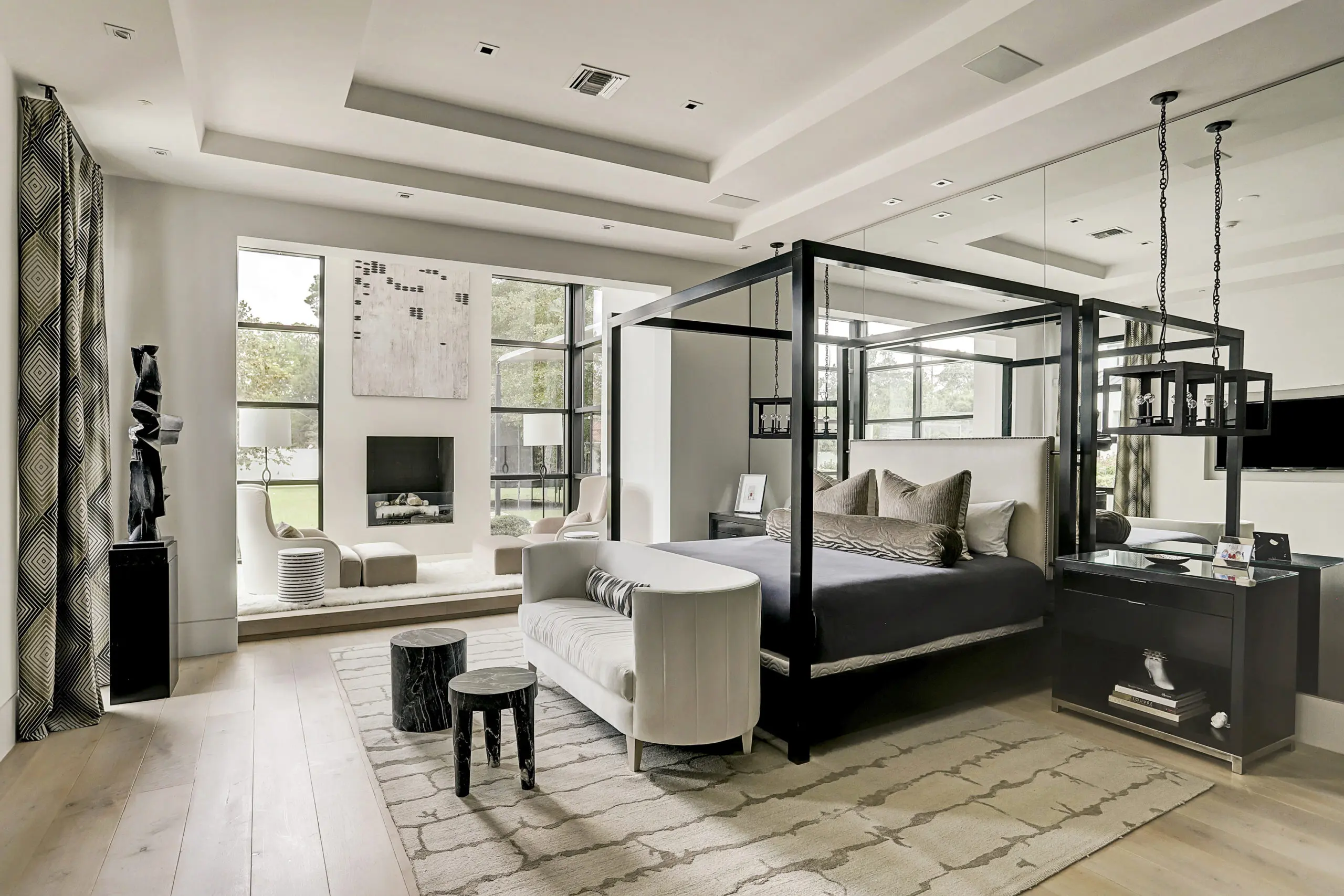 In addition to garden views, the master suite features a wall of floor-to-ceiling mirrors (Photo by TK Images)