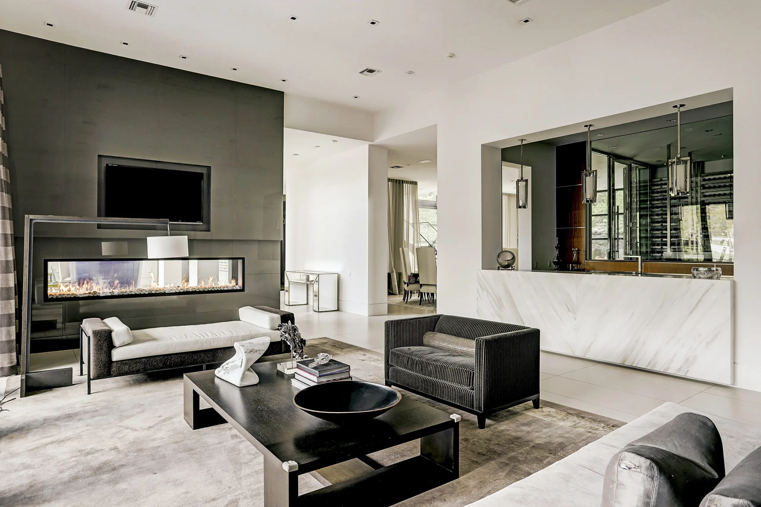 The family room which features a 10’ long linear, double-sided Montigo fireplace. 
 (Photo by TK Images)