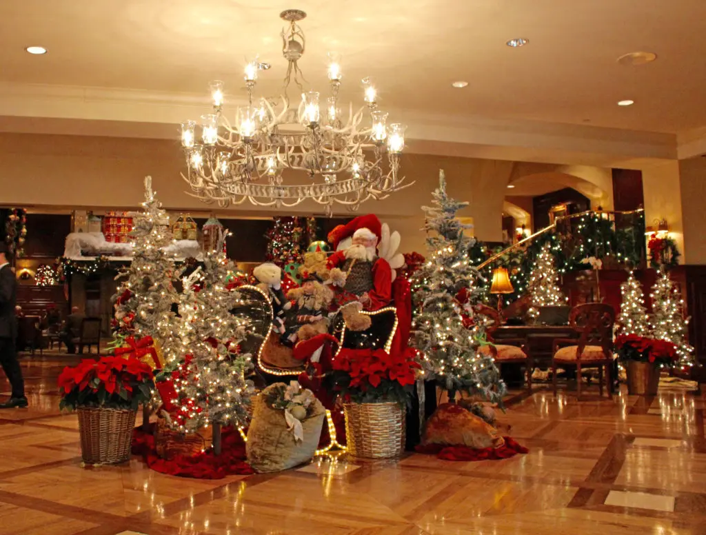 Santa rides his sleigh through The Houstonian lobby. (Photo courtesy The Houstonian Hotel, Club & Spa)