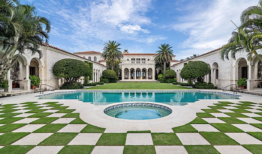 Stone tiles are laid in a checkerboard pattern in the area bordering the swimming pool of La Follia. (Photo by Giles Bradford, courtesy Douglas Elliman Real Estate)