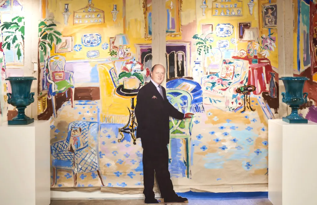 A cut-out of Buatta in front of a mural served as a photo op for the amusement of visitors to the Sotheby's exhibition and auction. (Photo by Gabby Jones)