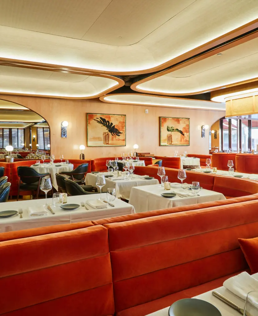 The interior, designed by a Brooklyn-based firm, is reminiscent of a 1970s Riva yacht. 