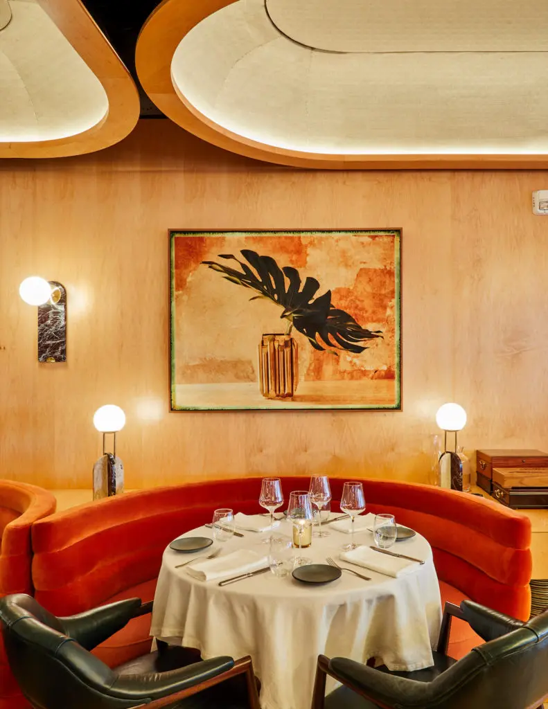 The interior, designed by a Brooklyn-based firm, is reminiscent of a 1970s Riva yacht. 