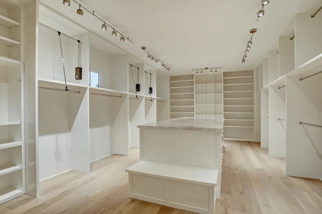 The packing island with storage drawers beneath is a derigueur for the ultimate closet.