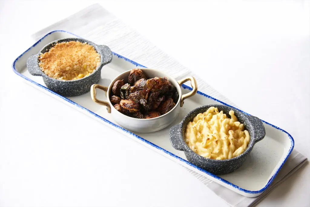 A side trio at Ellie's restaurant includes Brussel sprouts and macaroni and cheese. (Photography courtesy of Ellie's.) 