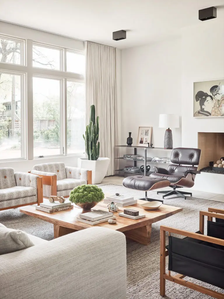 Chad Dorsey fell in love with the rugged wood-slab coffee table 15 years ago at a sample sale. Samsung Frame art TV over the fireplace. (Photo by Stephen Karlisch)