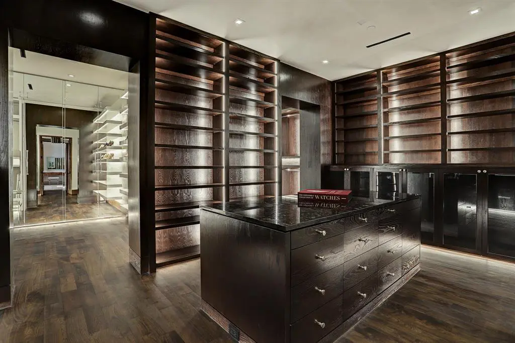 Note the adjoining lady's closet where her shoes get the special treatment as well in the home at 9111 Memorial Drive.