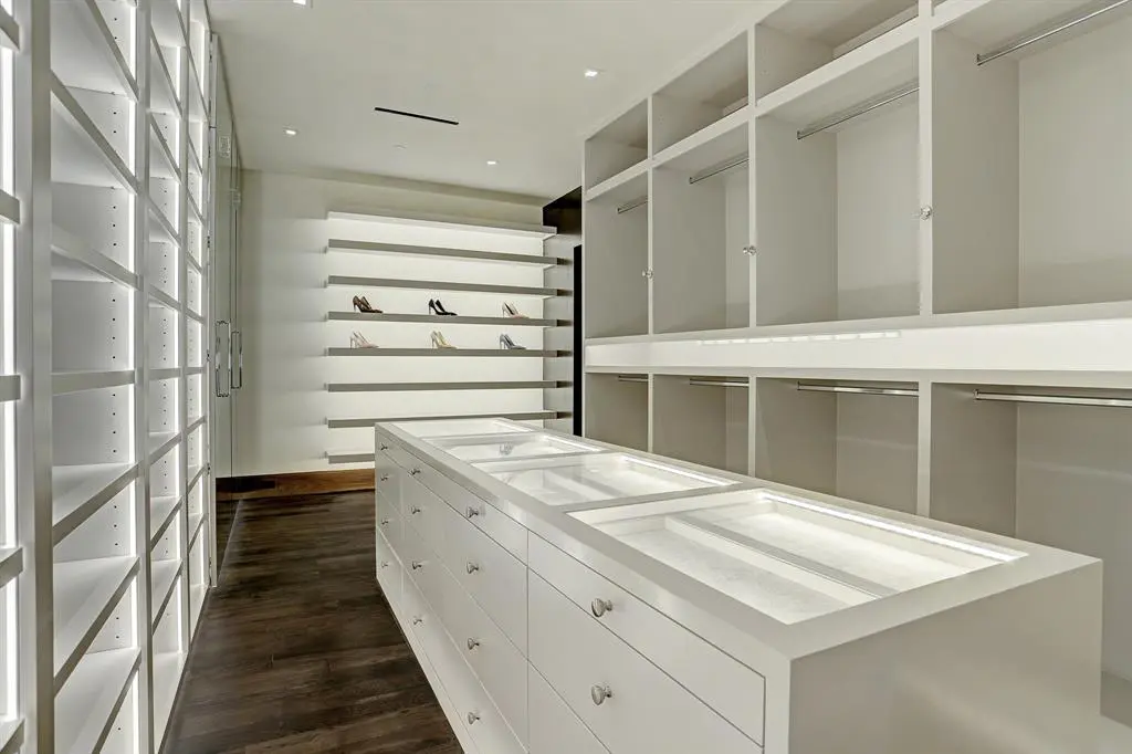 The feminine side of the master closet at 9111 Memorial is spacious and light-filled.