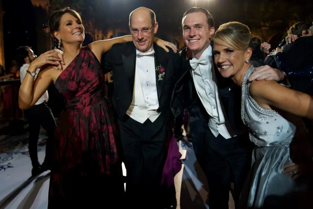 David Pruner, second from left, and Alie Pruner, far right, join wedding guests in a playful moment. (Photo by Graciela Ubando)